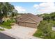 A nice home with a 3-car garage, well-maintained landscaping, and a neutral color palette at 2526 Brinley Dr, Trinity, FL 34655