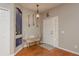 An inviting foyer with an alcove, accent lighting, and warm hardwood floors at 2526 Brinley Dr, Trinity, FL 34655