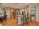 Bright eat-in kitchen with wood cabinets, stainless steel appliances, and breakfast bar at 2526 Brinley Dr, Trinity, FL 34655