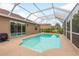 Inviting screened-in pool, adjacent to the home, allows for easy indoor/outdoor living at 2526 Brinley Dr, Trinity, FL 34655