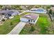 Aerial view of front yard and roof of bright home with large driveway at 277 Hampshire Ave, Spring Hill, FL 34606