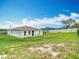 Green grass with room to entertain and relax in fenced backyard at 277 Hampshire Ave, Spring Hill, FL 34606