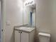 Bathroom vanity featuring granite countertop and white cabinets at 277 Hampshire Ave, Spring Hill, FL 34606
