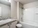 Bathroom featuring a tub with white enclosure and a granite-topped vanity at 277 Hampshire Ave, Spring Hill, FL 34606