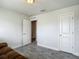 Bright bedroom featuring a neutral color palette and wood-look gray flooring at 277 Hampshire Ave, Spring Hill, FL 34606