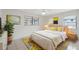 Cozy bedroom with modern decor, plush rug, and two windows offering plenty of natural light at 3427 Charmwood Ave, Spring Hill, FL 34609
