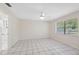 Spacious, bright bedroom with tiled flooring, ceiling fan, and lots of natural light at 3427 Charmwood Ave, Spring Hill, FL 34609