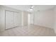 Bedroom featuring a large closet and tiled flooring with access to other rooms at 3427 Charmwood Ave, Spring Hill, FL 34609