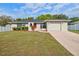 Charming single-story home with manicured lawn and a two car garage at 3427 Charmwood Ave, Spring Hill, FL 34609