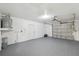 Spacious garage with epoxy floors and ample storage space at 3427 Charmwood Ave, Spring Hill, FL 34609