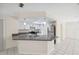 Well-equipped kitchen featuring a breakfast bar with granite countertops, stainless appliances, and tile flooring at 3427 Charmwood Ave, Spring Hill, FL 34609