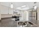 Close up of modern kitchen with granite countertops, stainless appliances, and a bright, skylight at 3427 Charmwood Ave, Spring Hill, FL 34609
