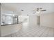 Open-concept kitchen with breakfast bar, white cabinetry, and tile floors, ideal for entertaining at 3427 Charmwood Ave, Spring Hill, FL 34609