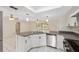 Bright kitchen with stainless steel appliances, double sink, and modern fixtures at 3427 Charmwood Ave, Spring Hill, FL 34609