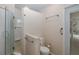 Clean bathroom with glass shower, new toilet and a door to the screened-in porch at 3609 Montclair Dr, New Port Richey, FL 34655