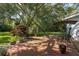 Wooden patio deck with greenery, perfect for outdoor relaxing at 3609 Montclair Dr, New Port Richey, FL 34655