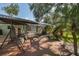Wooden patio deck leading to screened pool with swing and ample seating at 3609 Montclair Dr, New Port Richey, FL 34655