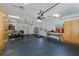 A spacious garage features ample shelving and storage at 3609 Montclair Dr, New Port Richey, FL 34655