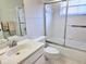 Bright bathroom featuring a clean, well-maintained shower and vanity with neutral decor and modern fixtures at 3627 Muirfield Ct # 3627, New Port Richey, FL 34655