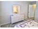 Bedroom view showcasing dresser, carpet, and accent molding at 3627 Muirfield Ct # 3627, New Port Richey, FL 34655