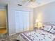 Bedroom with closet, bedside table and lamp at 3627 Muirfield Ct # 3627, New Port Richey, FL 34655