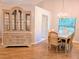 Dining room featuring a decorative china cabinet, dining table and a view of the rear yard at 3627 Muirfield Ct # 3627, New Port Richey, FL 34655