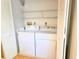 The laundry room has a full-size washer and dryer at 3627 Muirfield Ct # 3627, New Port Richey, FL 34655