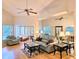 Spacious living room with vaulted ceilings, a ceiling fan, and neutral paint at 3627 Muirfield Ct # 3627, New Port Richey, FL 34655