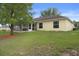 Enjoy the outdoors from this cozy screened porch, overlooking a lush lawn at 3631 Celebration Dr, Brooksville, FL 34604