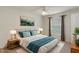 Stylishly staged bedroom with neutral colors, soft carpet and a ceiling fan at 3631 Celebration Dr, Brooksville, FL 34604