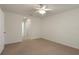 Neutral bedroom with carpet, ceiling fan, and ensuite bathroom at 3631 Celebration Dr, Brooksville, FL 34604