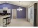 Open dining room with barstool seating, stainless appliances, and natural light at 3631 Celebration Dr, Brooksville, FL 34604