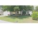 Charming single-story home with a well-maintained lawn and attached two-car garage at 3631 Celebration Dr, Brooksville, FL 34604