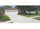 Charming single-story home with a well-maintained lawn and attached two-car garage at 3631 Celebration Dr, Brooksville, FL 34604