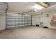 Spacious garage with ample room for parking and storage with lots of organizational shelving at 3631 Celebration Dr, Brooksville, FL 34604