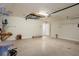 View of the spacious garage featuring a work bench and a doorway leading to the rest of the house at 3631 Celebration Dr, Brooksville, FL 34604