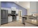 Stylish kitchen with stainless steel appliances, white cabinets, and a large open layout at 3631 Celebration Dr, Brooksville, FL 34604