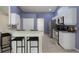 Bright kitchen features stainless steel appliances, white cabinets, and a cozy breakfast bar at 3631 Celebration Dr, Brooksville, FL 34604
