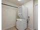 Efficient laundry area featuring a stacked washer and dryer for space-saving convenience at 3631 Celebration Dr, Brooksville, FL 34604