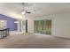 Bright living room offering backyard access, adjoined by barstool seating at 3631 Celebration Dr, Brooksville, FL 34604