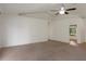 Empty living room with high ceilings, a ceiling fan and access to the outdoors at 3631 Celebration Dr, Brooksville, FL 34604