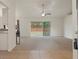 Open living room with carpet and sliding glass doors to the backyard at 3631 Celebration Dr, Brooksville, FL 34604