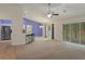 Open floor plan with barstool seating, dining area, and backyard access at 3631 Celebration Dr, Brooksville, FL 34604