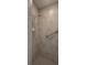 Handicap accessible shower with tile walls and a shower head and grab bar at 3631 Celebration Dr, Brooksville, FL 34604