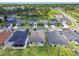 Aerial view of a residential neighborhood showcasing well-maintained homes, green spaces, and tree-lined streets at 3886 Reflection Dock Dr, Seffner, FL 33584