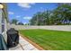 Spacious backyard featuring a well-maintained lawn and full white fence, perfect for outdoor enjoyment at 3886 Reflection Dock Dr, Seffner, FL 33584