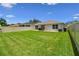 Expansive backyard featuring lush green lawn and a patio perfect for outdoor entertaining at 3886 Reflection Dock Dr, Seffner, FL 33584