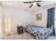 Cozy bedroom features soft carpet, a ceiling fan, and a comfortable bed, creating a relaxing retreat at 3886 Reflection Dock Dr, Seffner, FL 33584