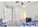 Comfortable bedroom with carpet flooring, ample closet space, and a ceiling fan, providing a cozy and functional space at 3886 Reflection Dock Dr, Seffner, FL 33584