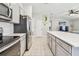 Well-equipped kitchen offering stainless steel appliances and seamless flow into the living space at 3886 Reflection Dock Dr, Seffner, FL 33584